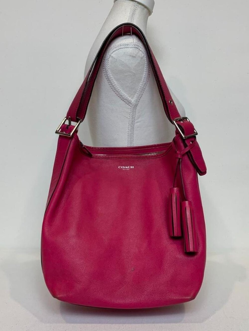 Vibrant fuchsia pink Coach Legacy leather